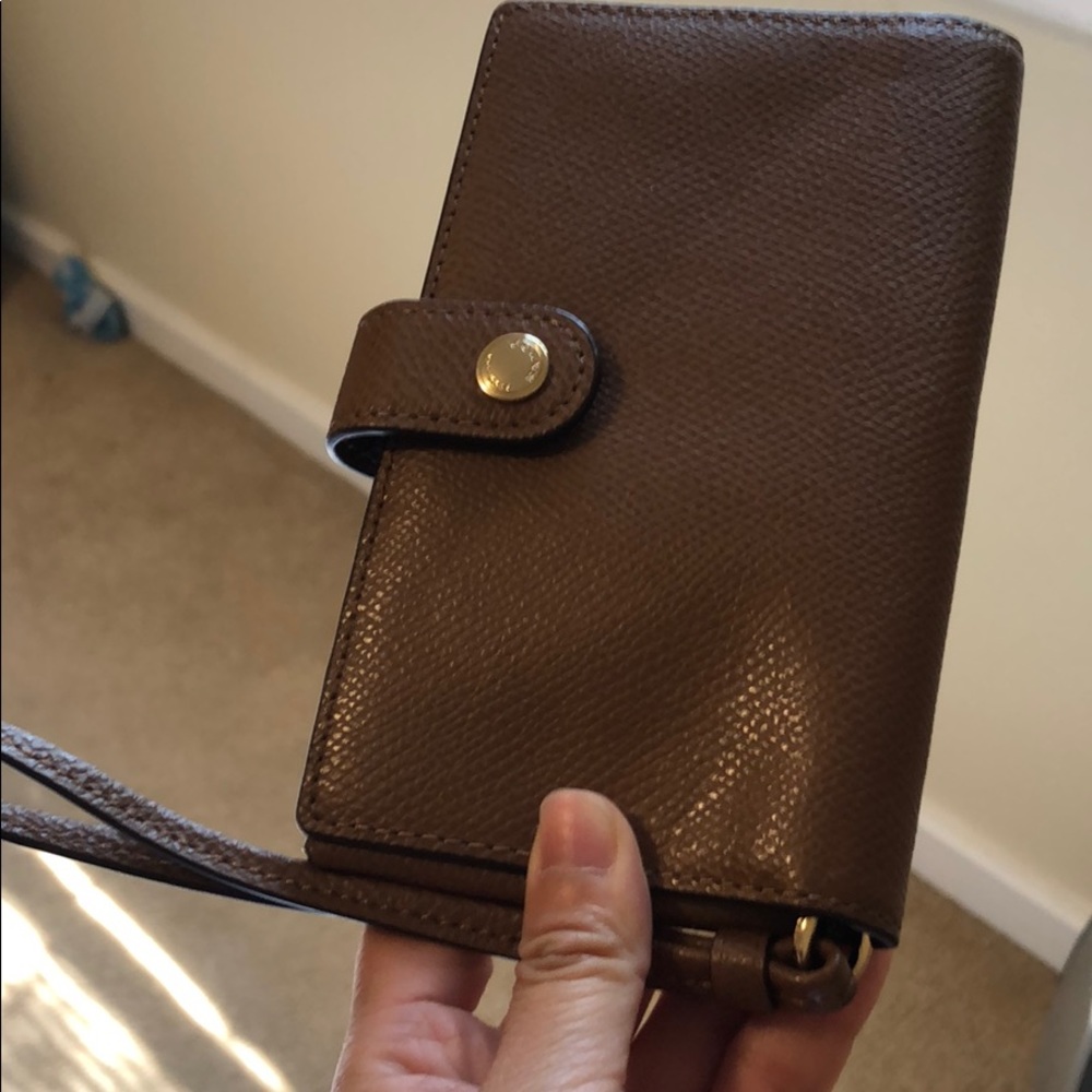 Brown Coach leather wristlet never used